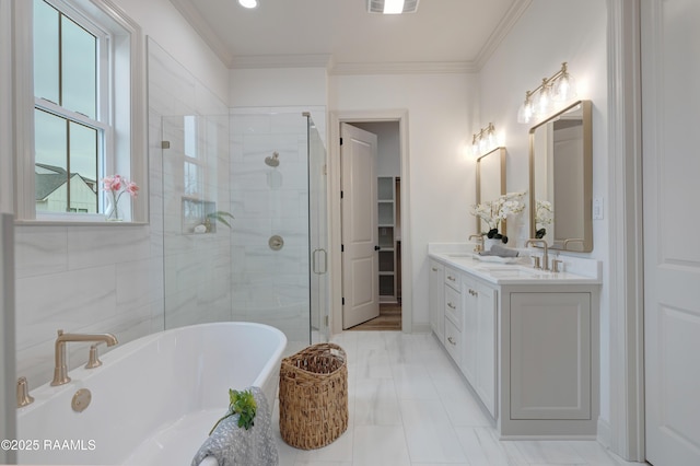 full bathroom with crown molding, a soaking tub, visible vents, a sink, and a shower stall