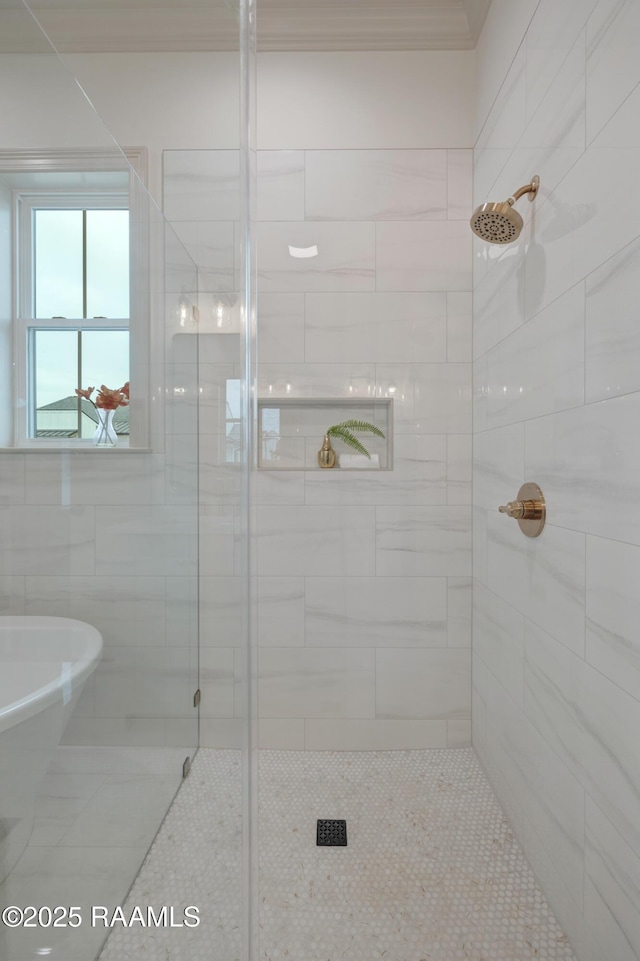 bathroom featuring a soaking tub, a shower stall, and tile patterned flooring