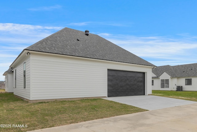 view of side of property with a yard, roof with shingles, and cooling unit