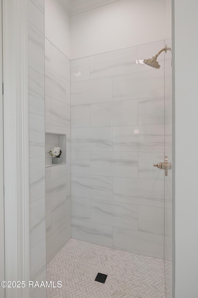 bathroom with a tile shower