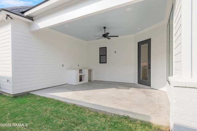 view of patio featuring ceiling fan