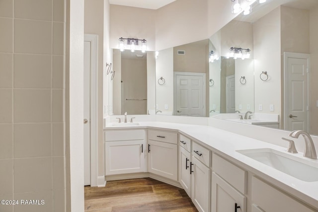 201 Settlers Trace Blvd Unit 2401, Lafayette, LA 70508 - bathroom featuring double vanity and wood finished floors