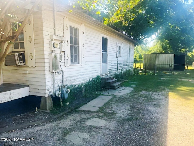 view of property exterior with cooling unit