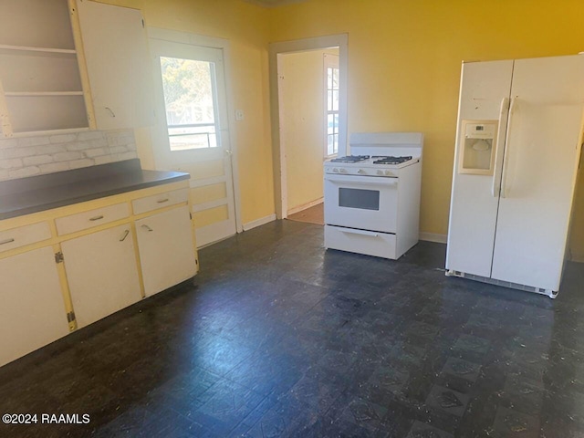 kitchen featuring white appliances and backsplash