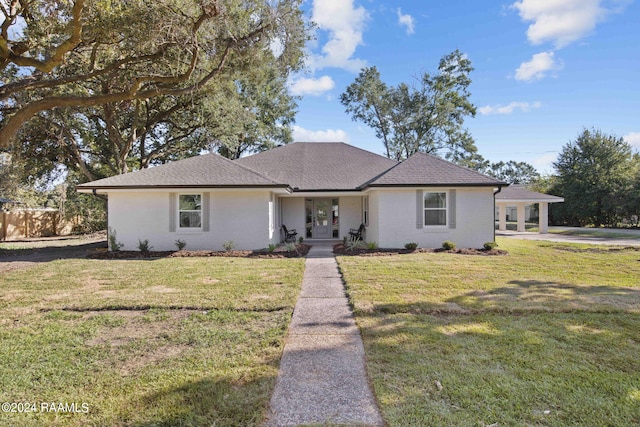 ranch-style house with a front lawn