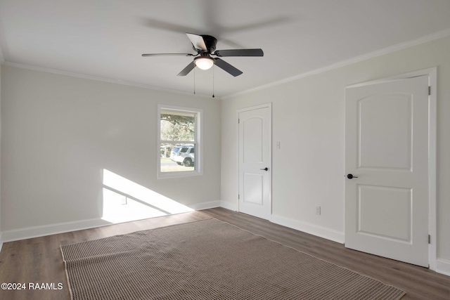 unfurnished room with ceiling fan, ornamental molding, and dark hardwood / wood-style floors