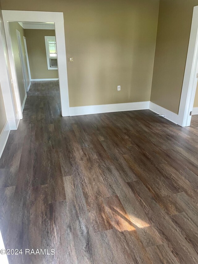 604 N Lejeune Ave, Kaplan, LA 70548 - unfurnished room with dark wood finished floors and baseboards