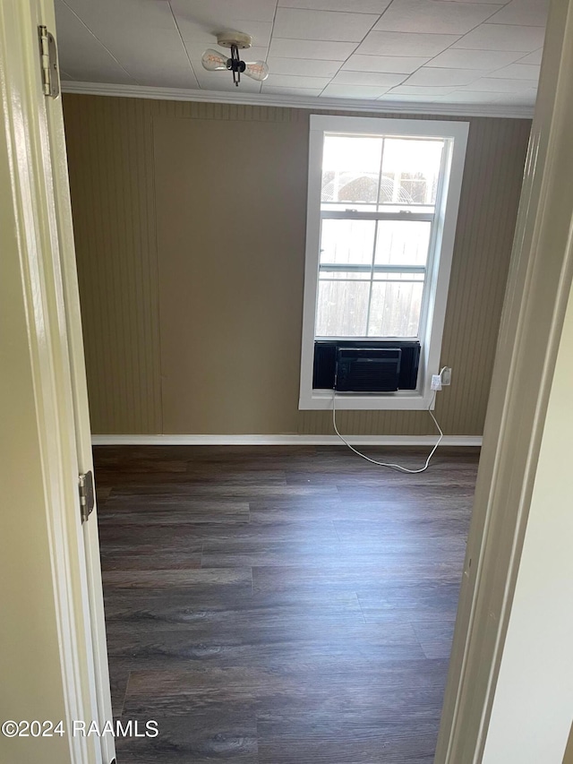 604 N Lejeune Ave, Kaplan, LA 70548 - spare room with ornamental molding, dark wood-type flooring, baseboards, and cooling unit
