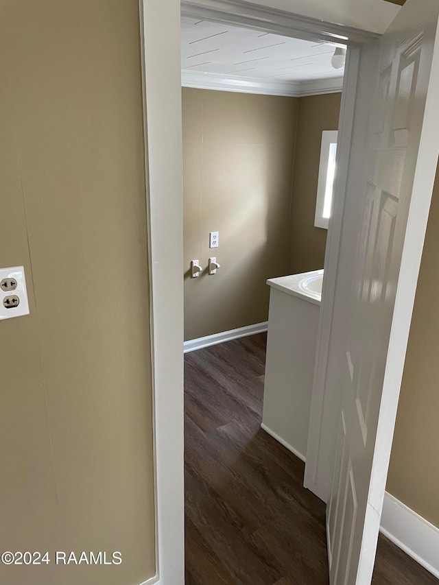 604 N Lejeune Ave, Kaplan, LA 70548 - corridor featuring dark wood-style flooring, ornamental molding, and baseboards