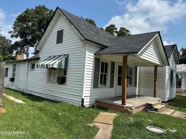 604 N Lejeune Ave, Kaplan, LA 70548 - view of home's exterior with a yard and a shingled roof