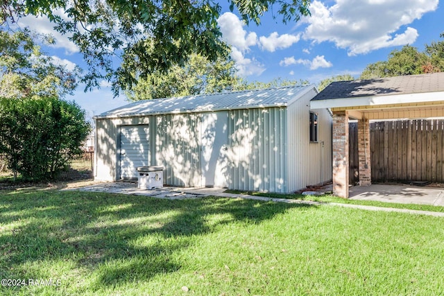 exterior space with a yard and an outdoor structure