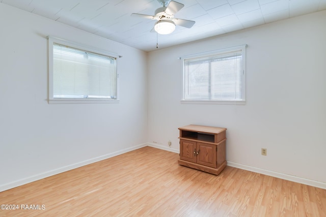 empty room featuring light hardwood / wood-style flooring and ceiling fan