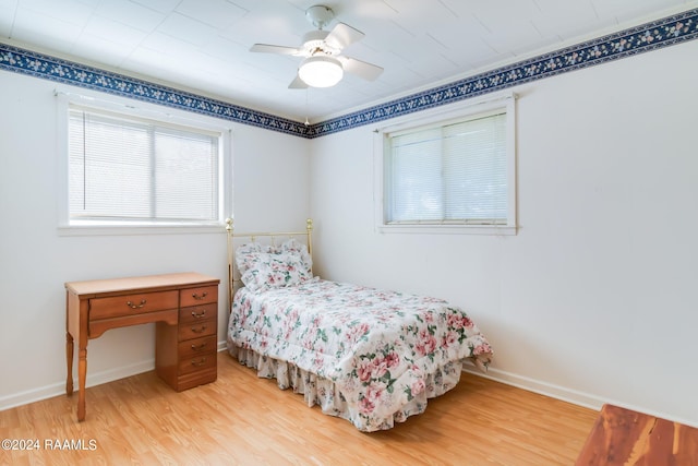 bedroom featuring light wood-type flooring and ceiling fan