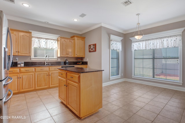 kitchen featuring a kitchen island, light tile patterned flooring, pendant lighting, and a healthy amount of sunlight