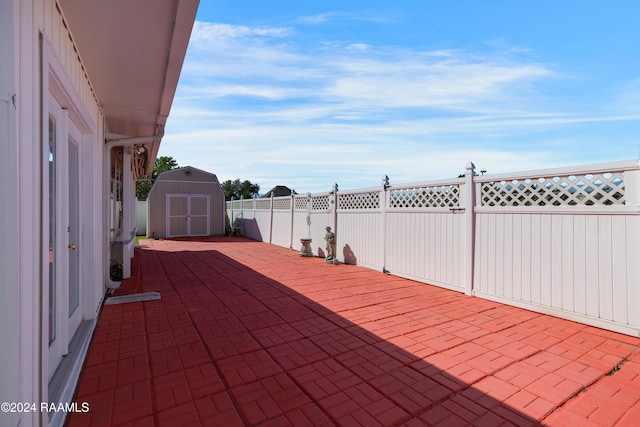 view of patio with a shed