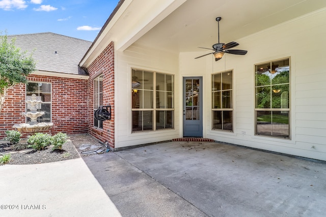 view of patio featuring ceiling fan