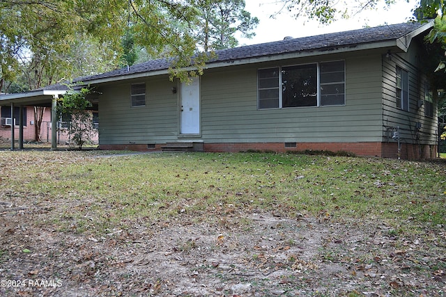 single story home featuring a front lawn