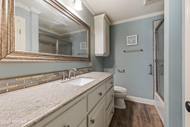 full bathroom with hardwood / wood-style flooring, toilet, backsplash, crown molding, and vanity