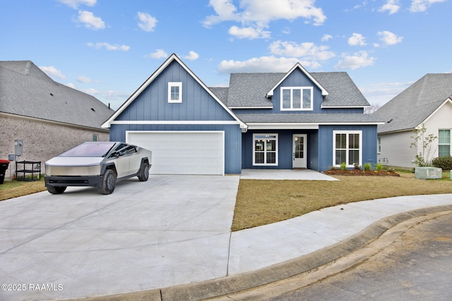 view of front of home with a garage and a front yard