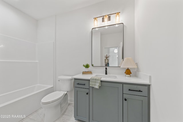 full bathroom with marble finish floor, toilet, vanity, tub / shower combination, and baseboards