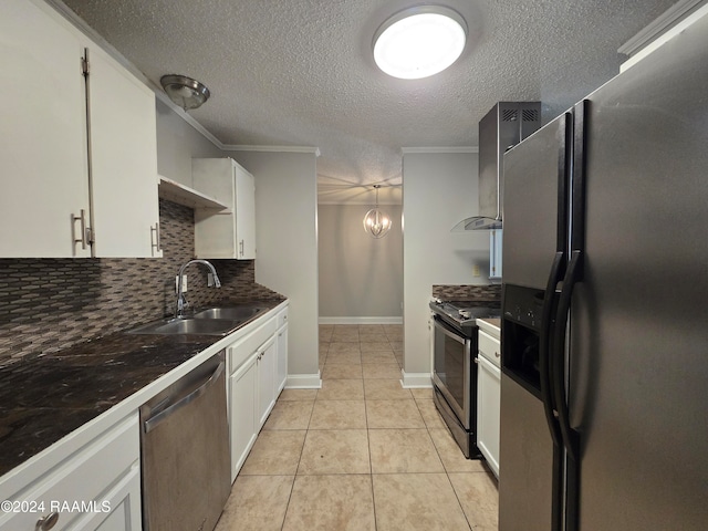 kitchen featuring stainless steel appliances, crown molding, sink, white cabinetry, and tasteful backsplash