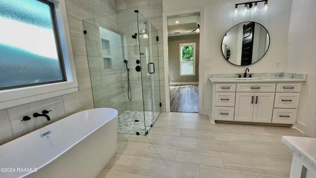 bathroom featuring tile patterned floors, vanity, and independent shower and bath