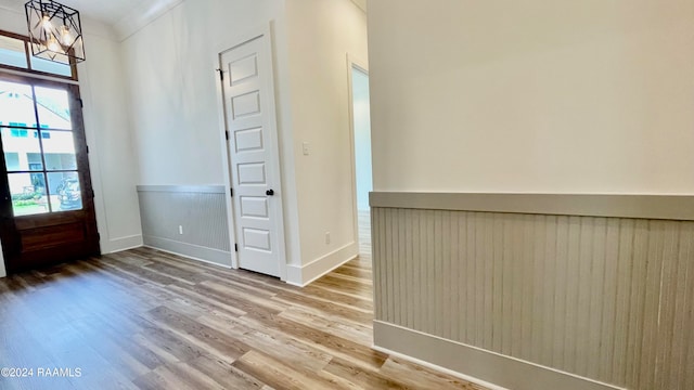 entryway with a chandelier and wood-type flooring