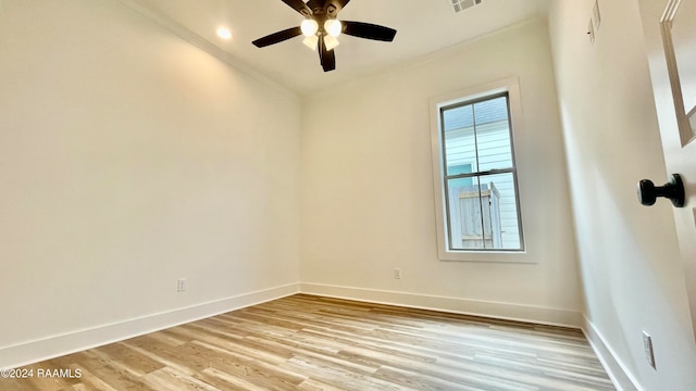 spare room with ceiling fan, light hardwood / wood-style floors, and ornamental molding