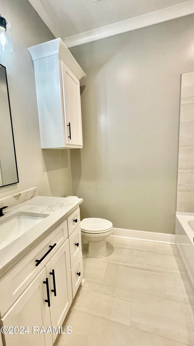 bathroom featuring vanity, a bath, crown molding, tile patterned flooring, and toilet