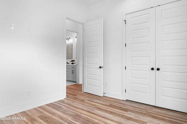 219 Harvest Creek Ln, Lafayette, LA 70508 - unfurnished bedroom featuring a closet and light wood finished floors