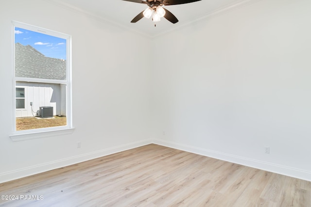 unfurnished room with ceiling fan, light wood-type flooring, and ornamental molding