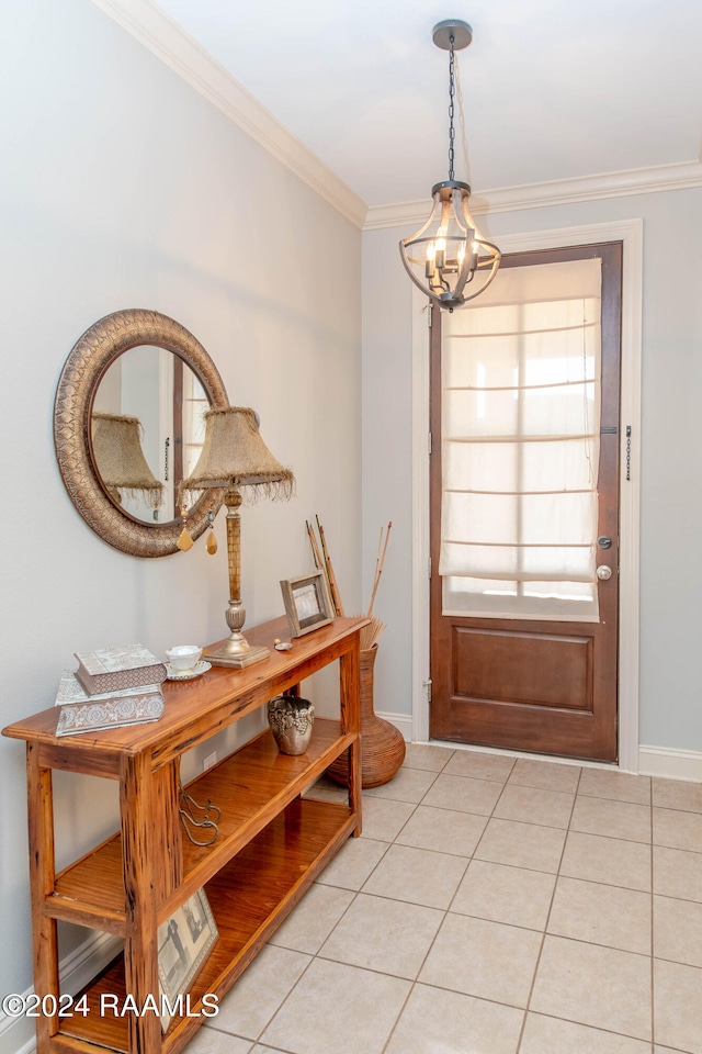 doorway to outside with ornamental molding, light tile patterned flooring, and a chandelier