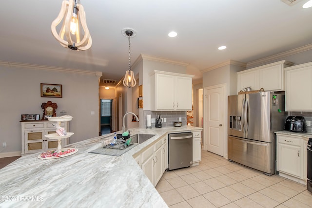 kitchen with decorative backsplash, light tile patterned floors, ornamental molding, decorative light fixtures, and stainless steel appliances