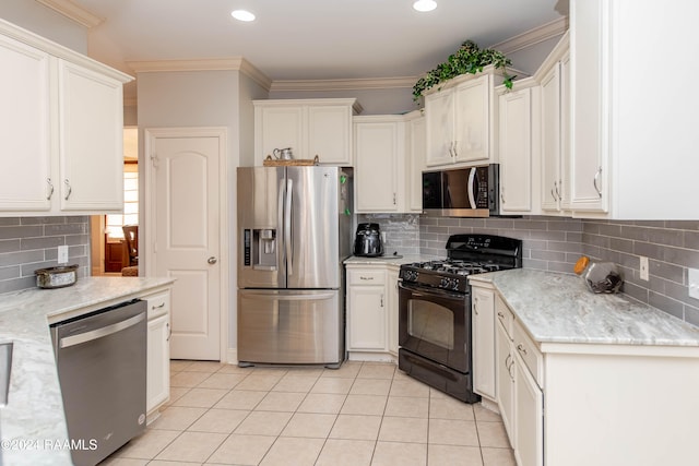 kitchen featuring ornamental molding, appliances with stainless steel finishes, tasteful backsplash, and light tile patterned flooring