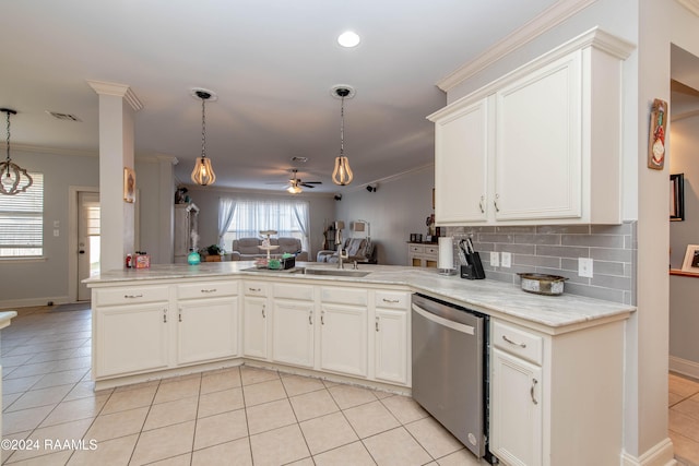 kitchen with hanging light fixtures, kitchen peninsula, crown molding, stainless steel dishwasher, and ceiling fan