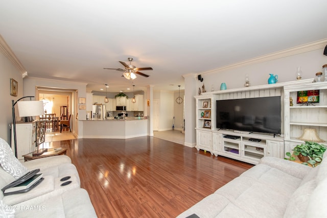 living room featuring crown molding, ceiling fan, and dark hardwood / wood-style flooring