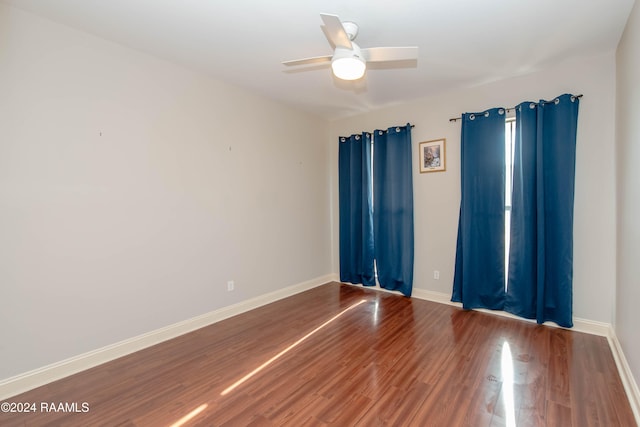 empty room featuring hardwood / wood-style floors and ceiling fan