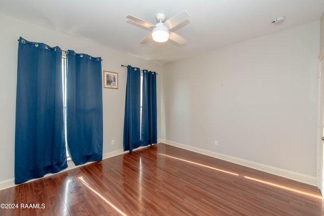 unfurnished room featuring hardwood / wood-style flooring and ceiling fan