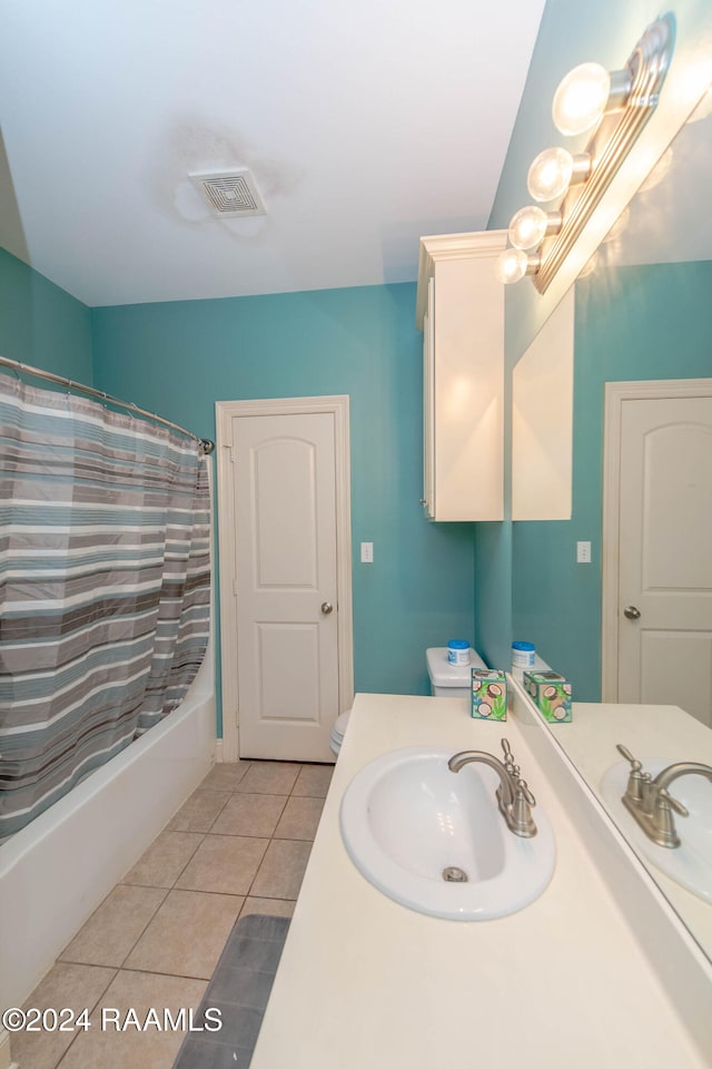 bathroom featuring vanity, shower / bath combo, and tile patterned floors