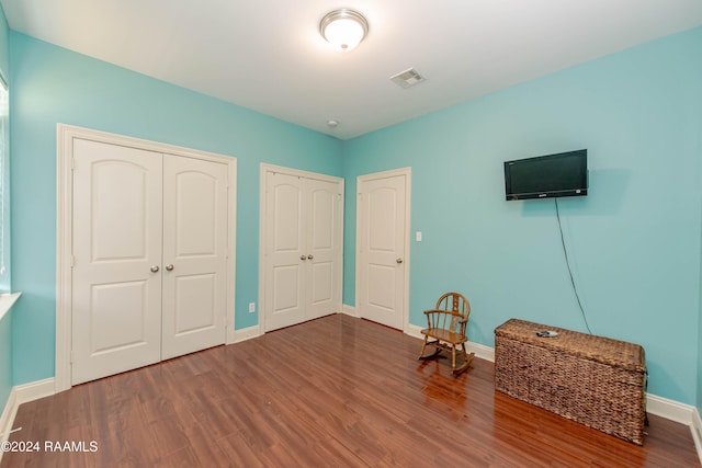 unfurnished room featuring hardwood / wood-style flooring