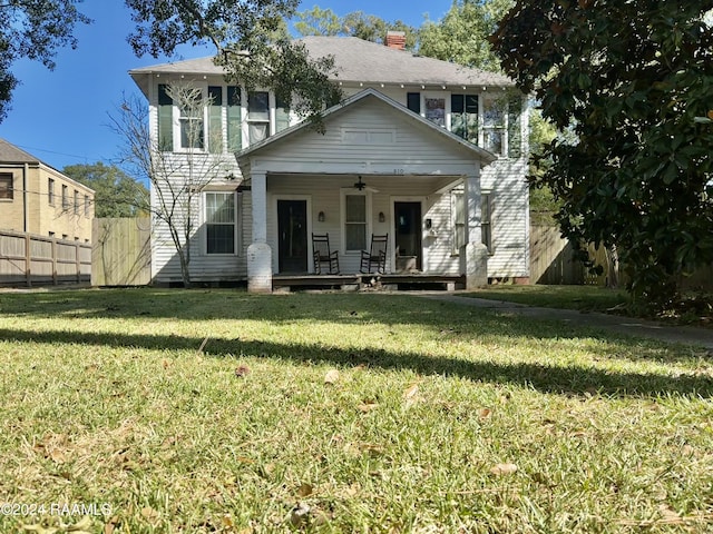 510 S Adams St, Welsh, LA 70591 - view of front facade with a porch, ceiling fan, and a chimney