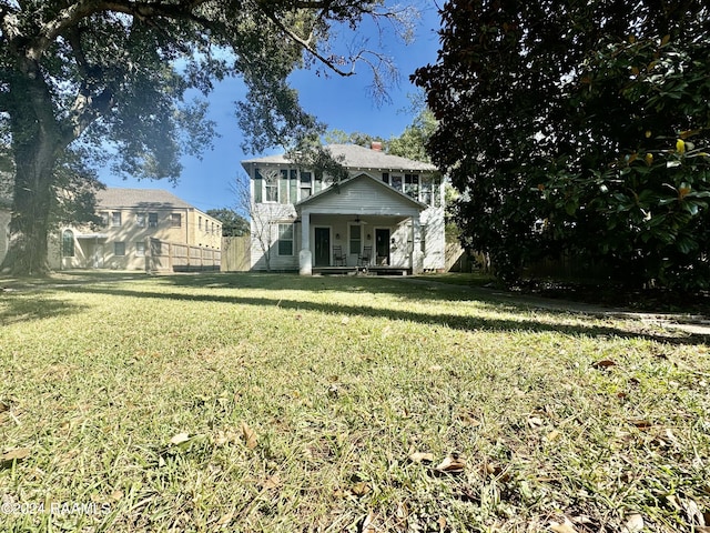 510 S Adams St, Welsh, LA 70591 - view of front of house featuring covered porch and a chimney