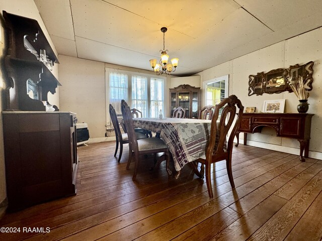 510 S Adams St, Welsh, LA 70591 - dining space featuring a chandelier and dark wood-style flooring