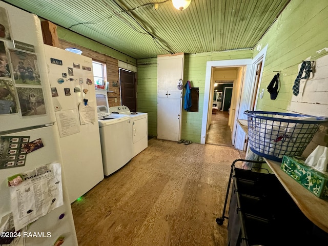 510 S Adams St, Welsh, LA 70591 - laundry room featuring washer and dryer, wooden walls, and light wood-style flooring