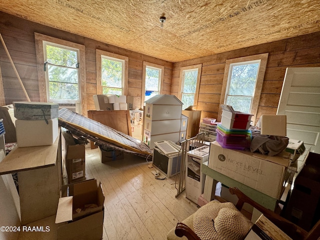 510 S Adams St, Welsh, LA 70591 - misc room with hardwood / wood-style flooring and wooden walls