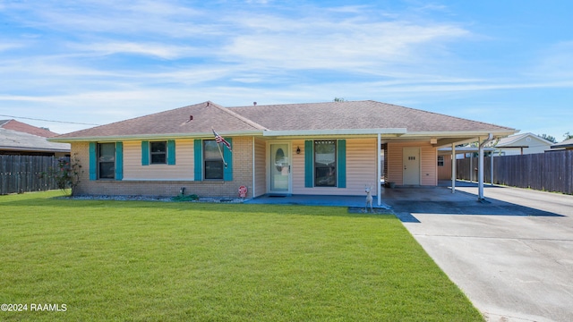 ranch-style home featuring a front yard and a carport