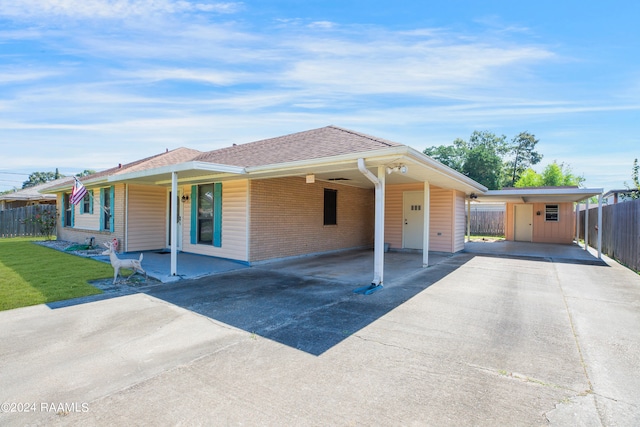 view of front of property featuring a carport