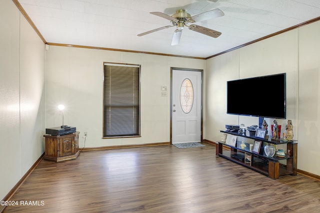 entrance foyer featuring crown molding, wood-type flooring, and ceiling fan