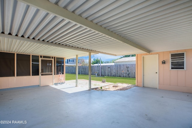 view of patio featuring a sunroom