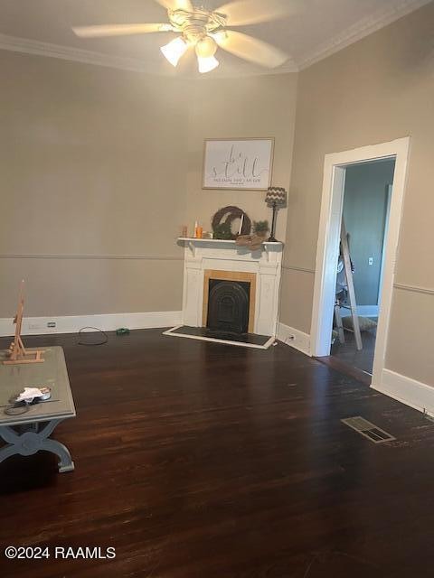 unfurnished living room with crown molding, hardwood / wood-style flooring, and ceiling fan